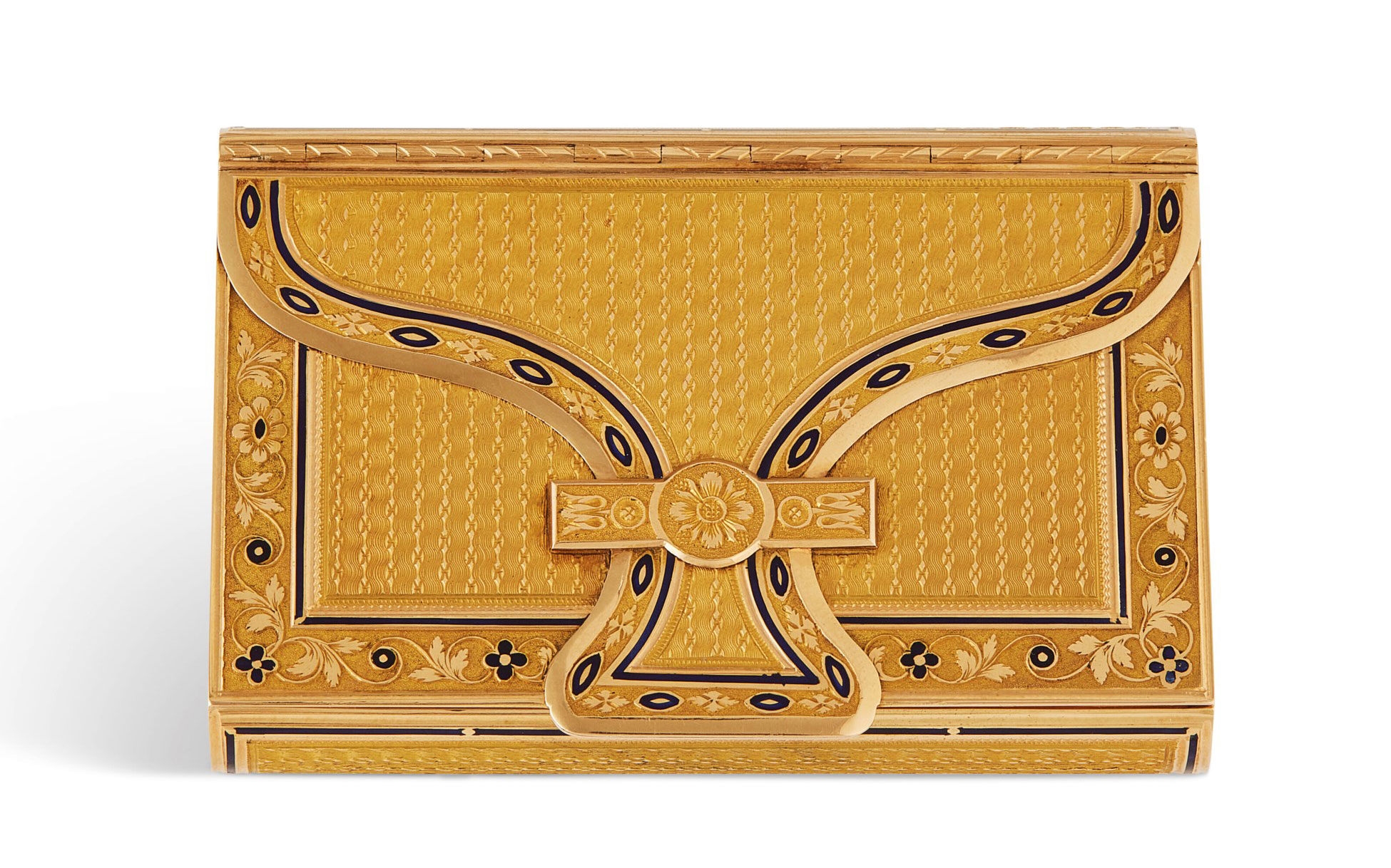 An ornate wooden box with intricate patterns and a central decorative clasp.
