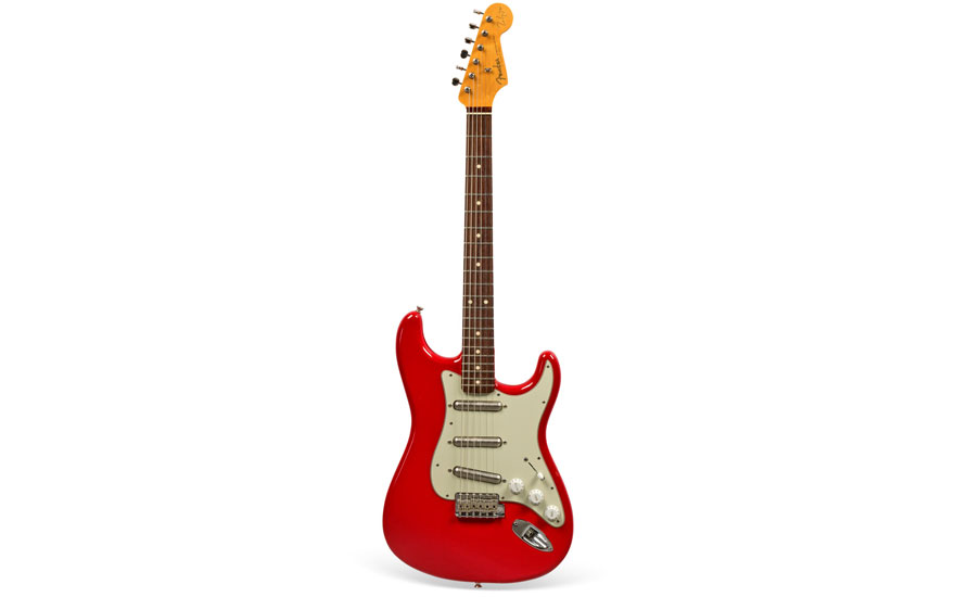 A red electric guitar with a traditional stratocaster shape, featuring three pickups and a white pickguard.