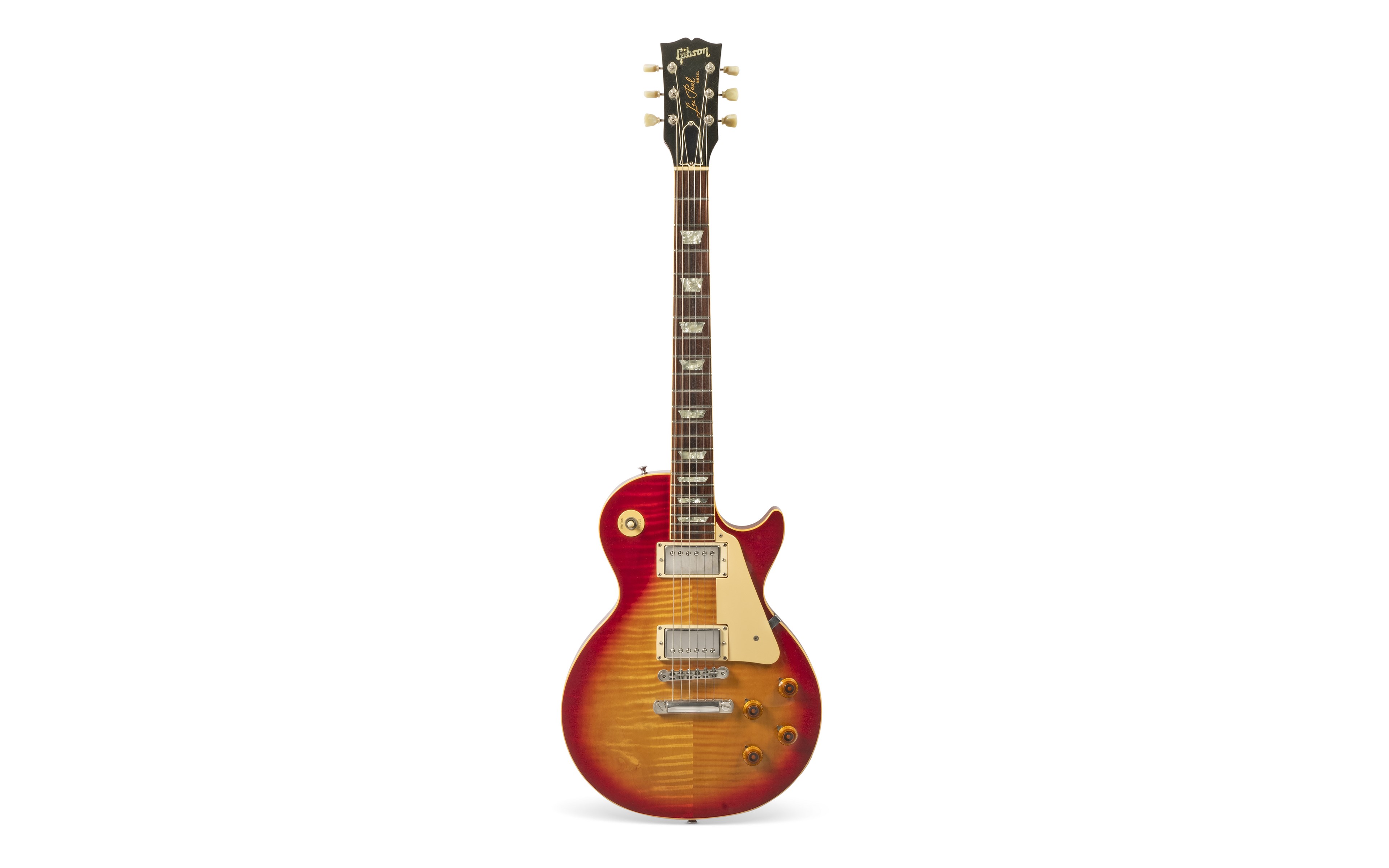 A classic red and amber sunburst electric guitar with multiple knobs and a double cutaway design, set against a white background.