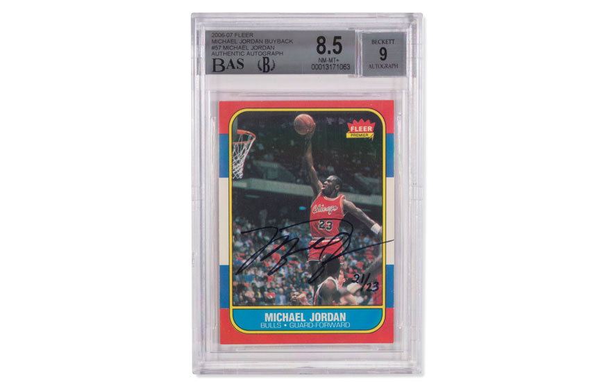 Encased sports card featuring Michael Jordan mid-action in a basketball game, signed, with grading details.