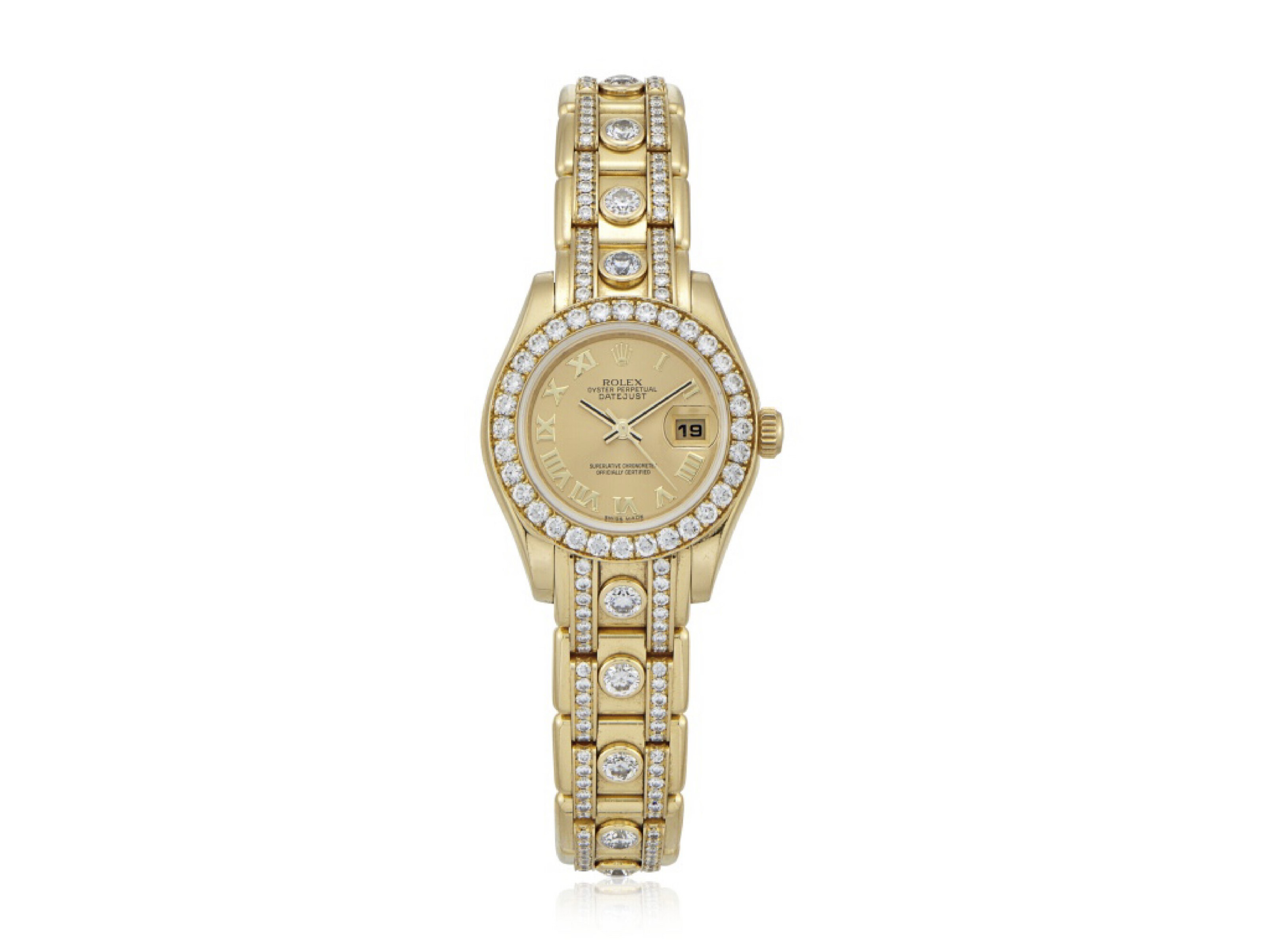 A gold wristwatch with diamond accents on the bezel and band, featuring a date display.