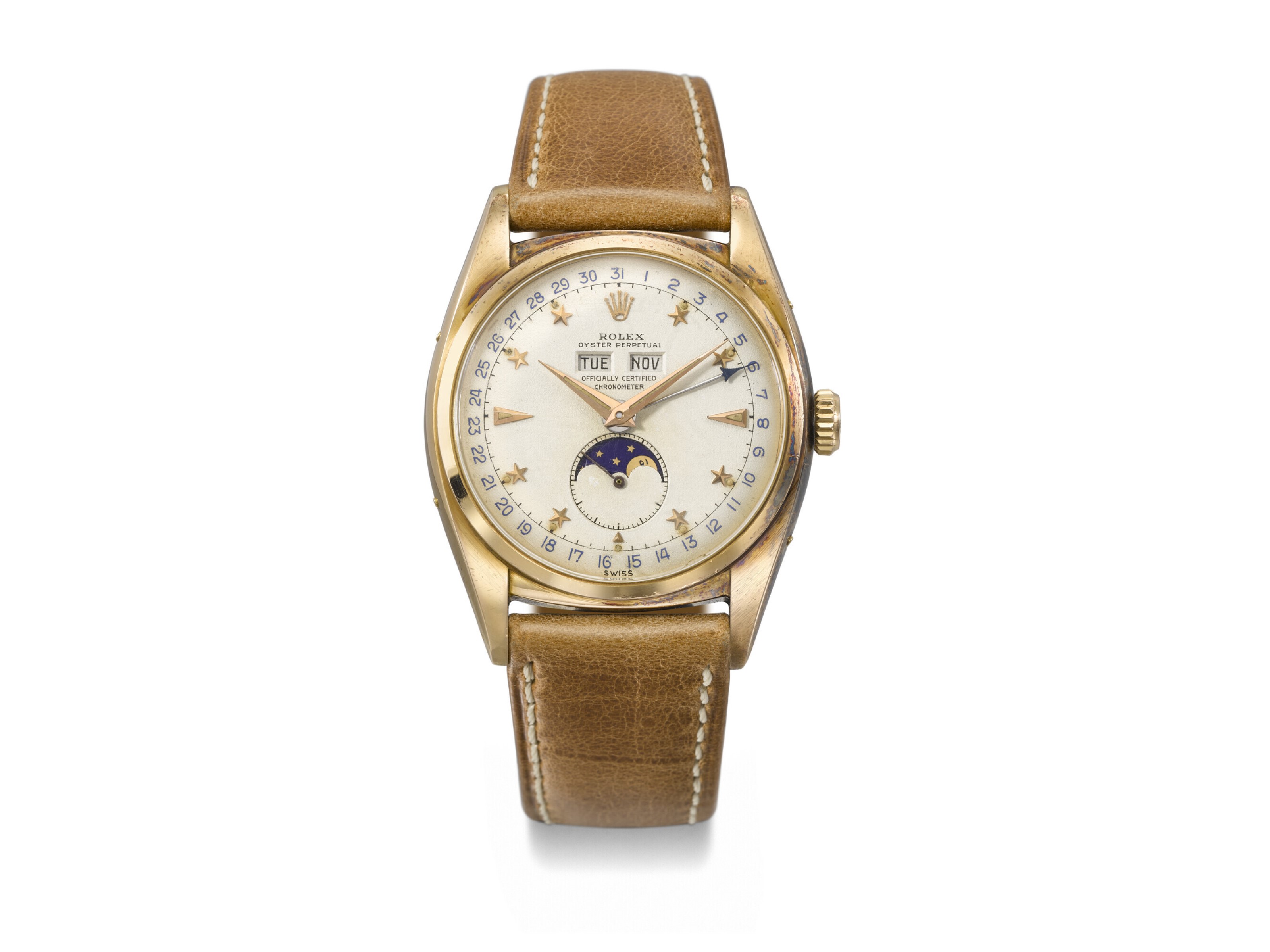 A vintage gold wristwatch with a leather strap and multiple dials, including a moon phase.