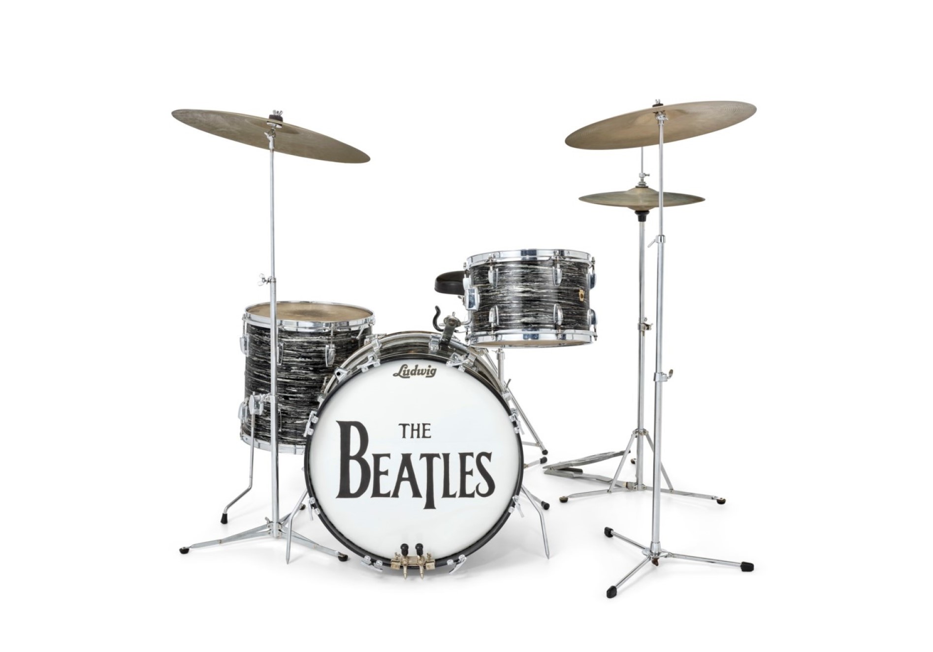 A drum set with "The Beatles" written on the bass drum.