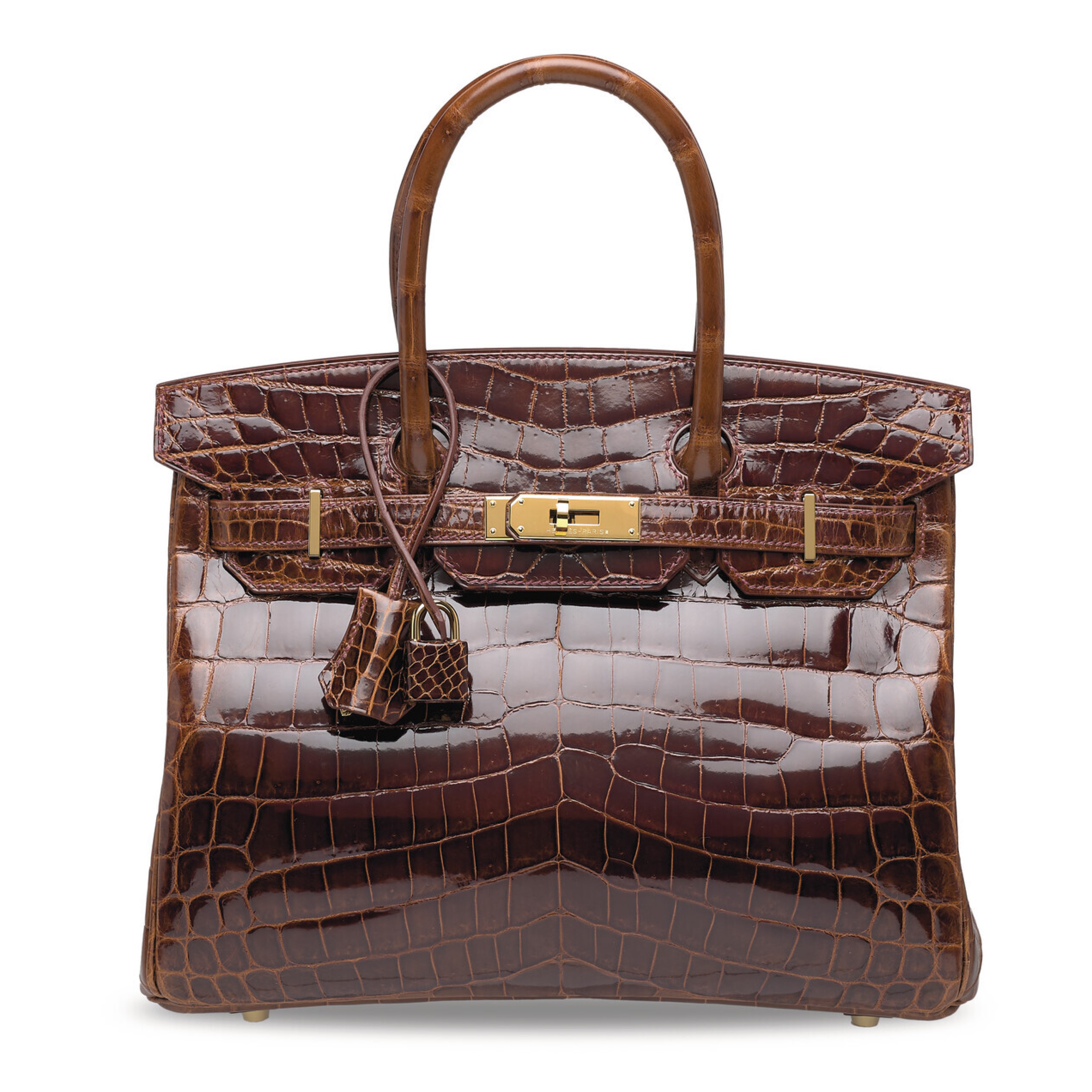 A glossy brown crocodile leather handbag with gold hardware and top handles.