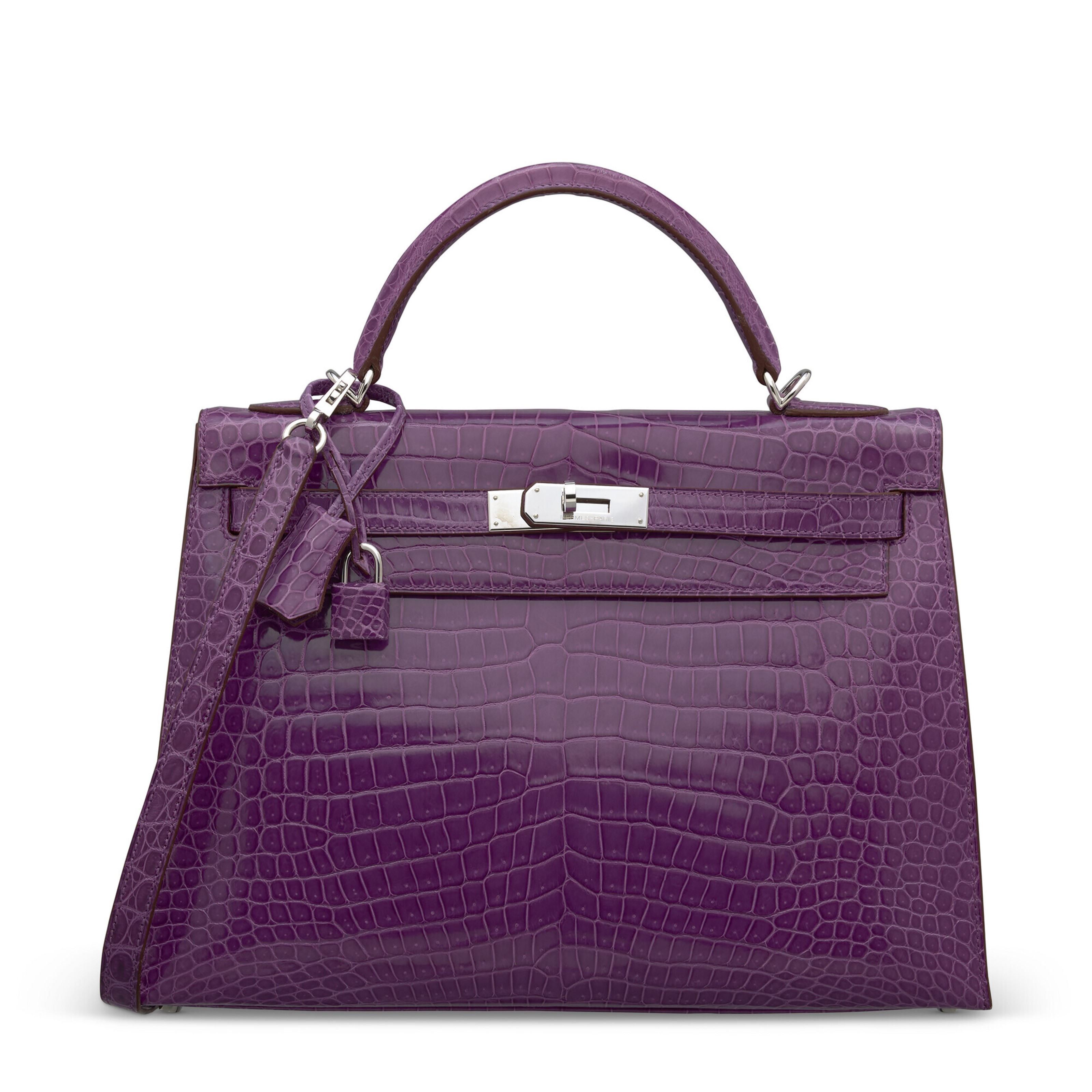 A purple crocodile leather handbag with a top handle and silver hardware.