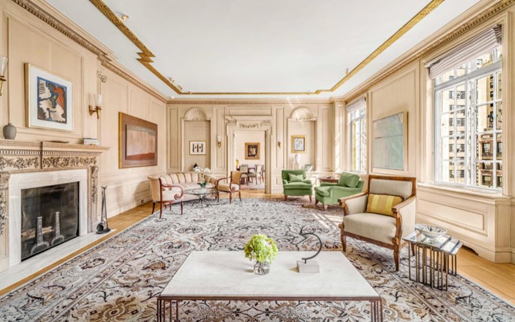 A spacious, elegant living room with classic décor, large windows, and sophisticated furniture.