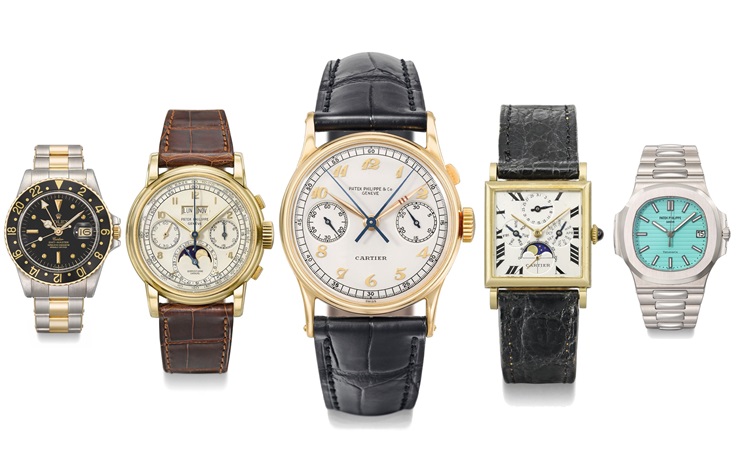 Five luxury wristwatches with various designs and bands are displayed side by side on a white background.