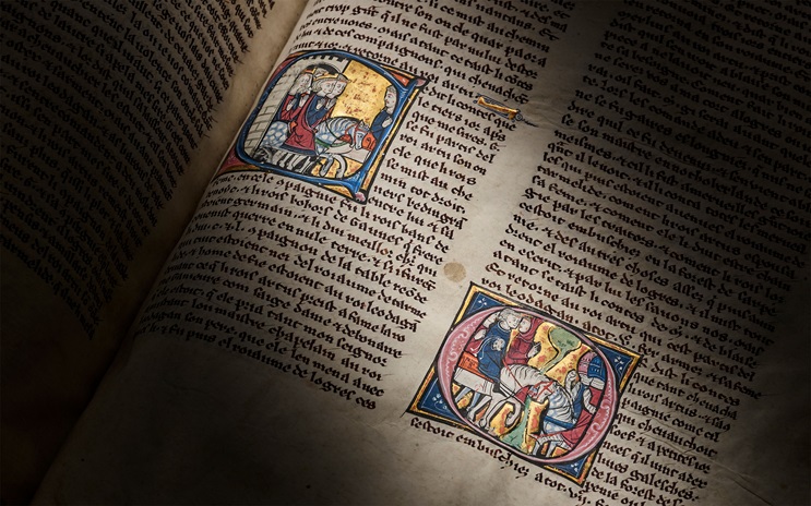 An illuminated manuscript features colorful medieval illustrations and ornate handwritten text.