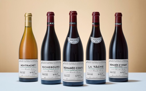 Five bottles of fine wine are displayed side by side with labeled fronts facing forward.