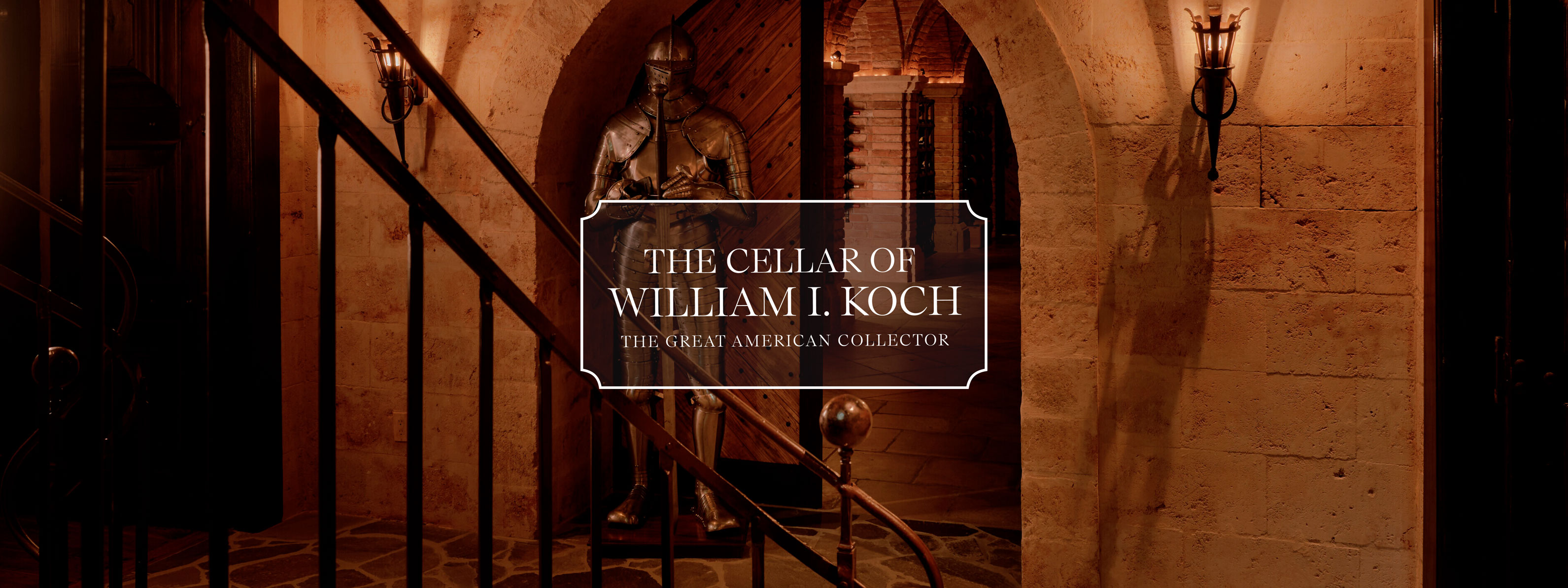 Elegant cellar entrance with a suit of armor, featuring an iron railing and stone archways, titled "The Cellar of William I. Koch."