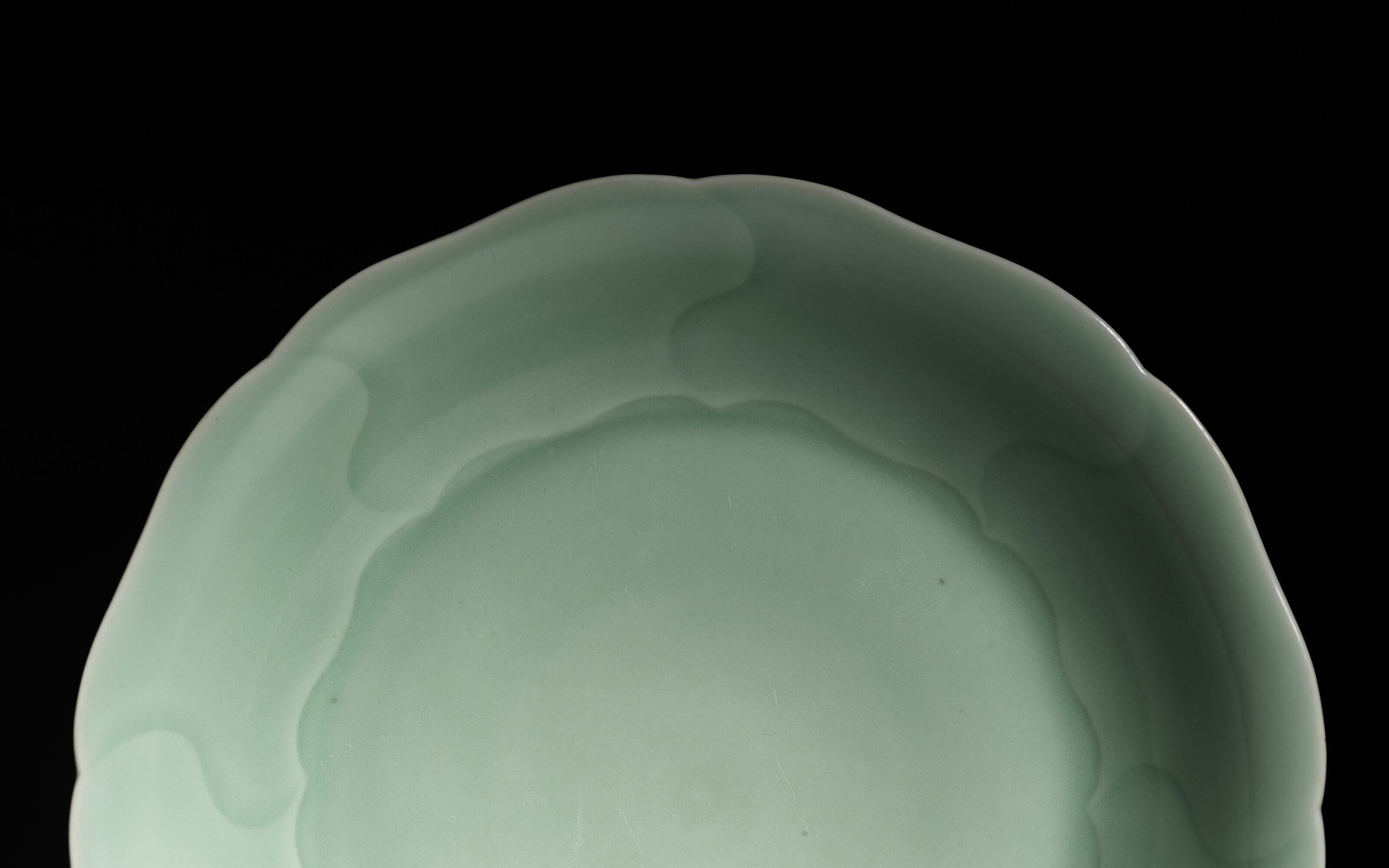 Modern skyscrapers with reflective glass facades under a blue sky, featuring prominent corporate logos.