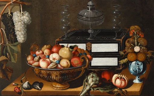 This is a detailed still life painting featuring an ornate bowl filled with various fruits, an open pomegranate, hanging grapes, and decorative vessels on a wooden table.