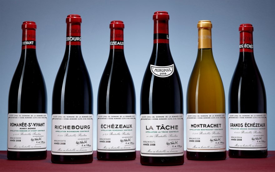Six bottles of Domaine de la Romanée-Conti wine, including Romanée-St-Vivant, Richebourg, Échezeaux, La Tâche, Montrachet, and Grands Échezeaux.