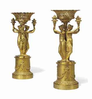 AN EMPIRE ORMOLU FIGURAL CENTREPIECE AND A MATCHING CENTREPIECE