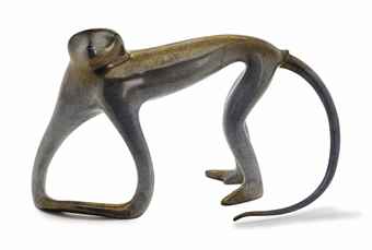 A CERAMIC LIFE-SIZE FIGURE OF A MONKEY