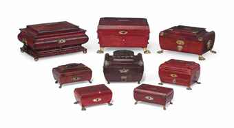 A COLLECTION OF EIGHT REGENCY GILT-BRASS MOUNTED AND RED-LEATHER SARCOPHAGUS-FORM SEWING