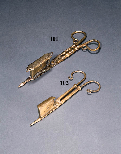 A BRASS CANDLE SNUFFER , NORTH WEST EUROPEAN, 17TH CENTURY Christie's