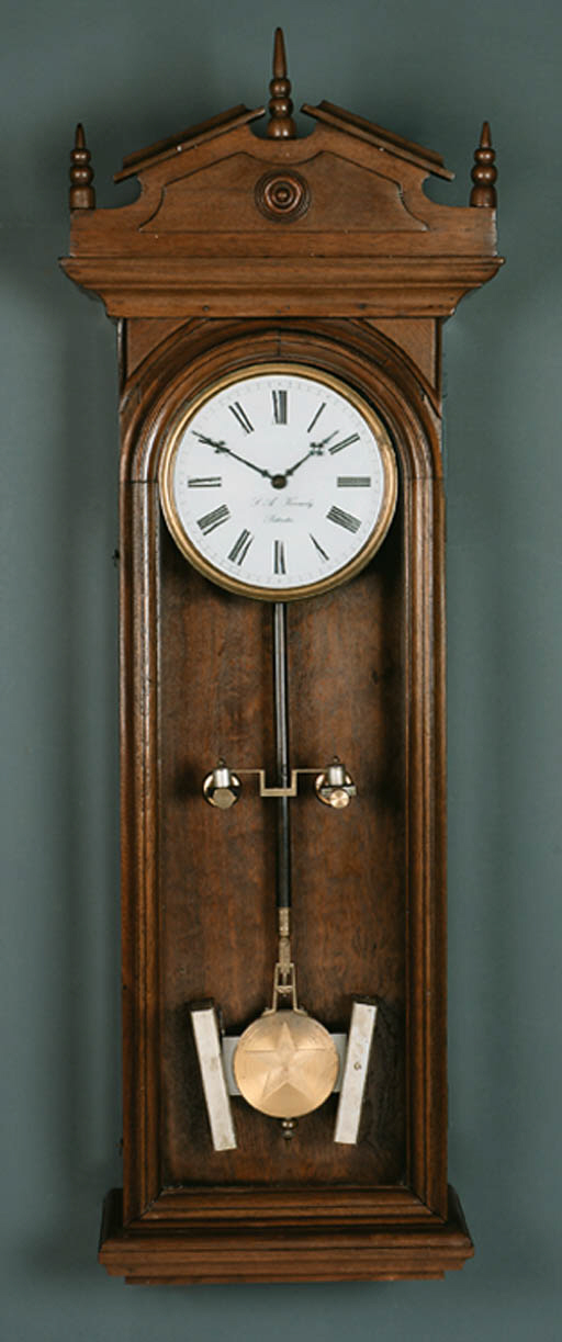 An American oak early electric wall regulator , S.A.KENNEDY, NEW YORK