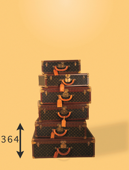 A Louis Vuitton hard case, covered in LV fabric and bound in leather