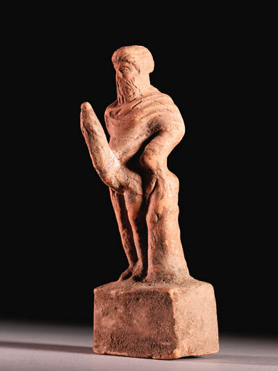A GREEK TERRACOTTA FIGURE OF PRIAPUS , HELLENISTIC PERIOD, CIRCA 