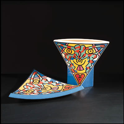 A fruitbowl and a vase 
