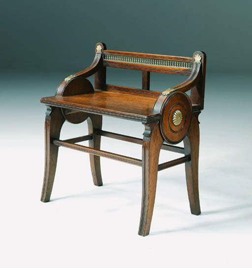 A LATE VICTORIAN BRASSMOUNTED MAHOGANY HALL STOOL