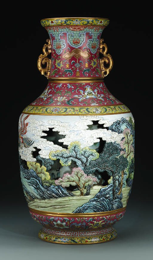 A VERY RARE MASSIVE CARVED FAMILLE ROSE REVOLVING VASE