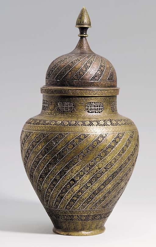 A QAJAR SILVER INLAID PIERCED BRASS VASE AND COVER , PERSIA, 19TH