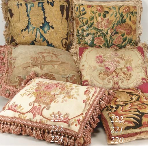 A pair of tapestry cushions, each woven in coloured wools with bright