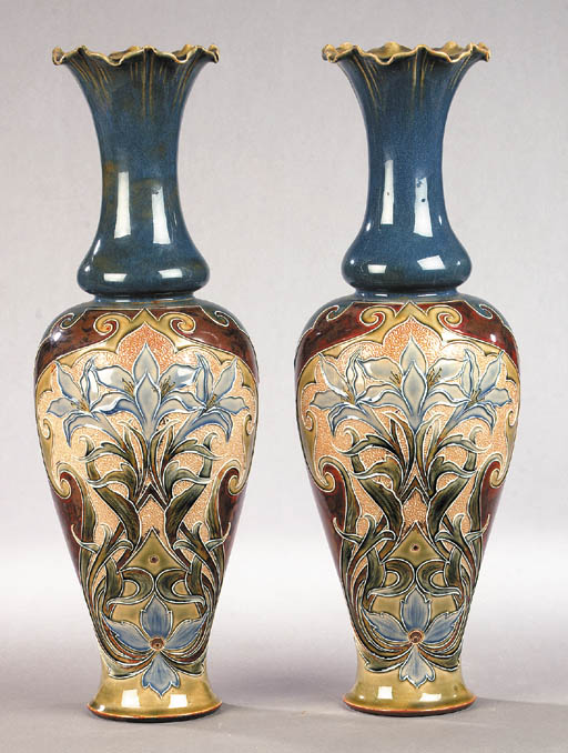 A pair of Doulton Lambeth stoneware vases A pair of Doulton Lambeth stoneware vases 