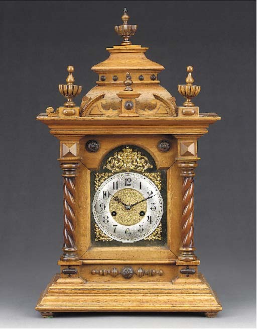 A German walnut striking mantel clock, early 20th century