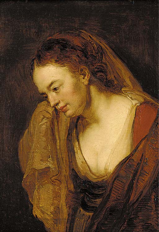 Portrait of a young woman, bust-length, wiping her tears 
