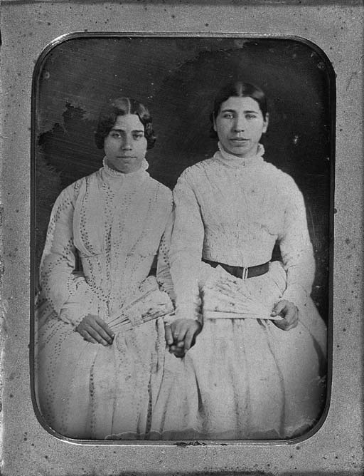 Sisters holding hands 
