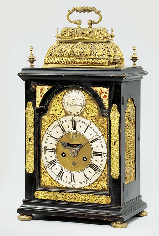 A Queen Anne ebonised and giltmetal mounted table clock
