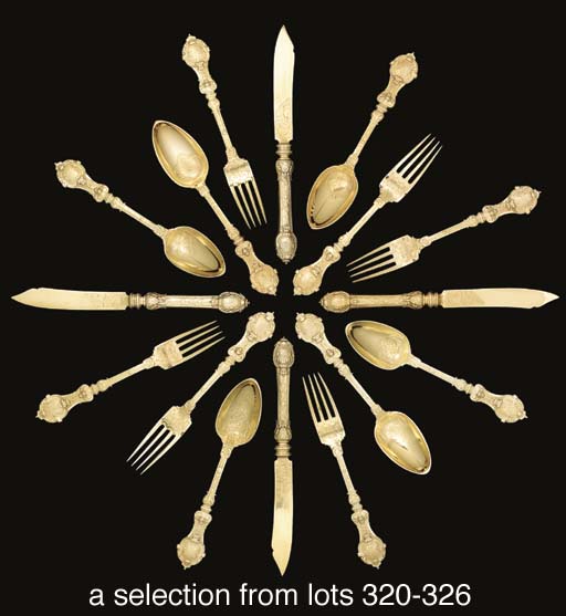 A set of German silvergilt dessertspoon, fork and knife, ensuite with