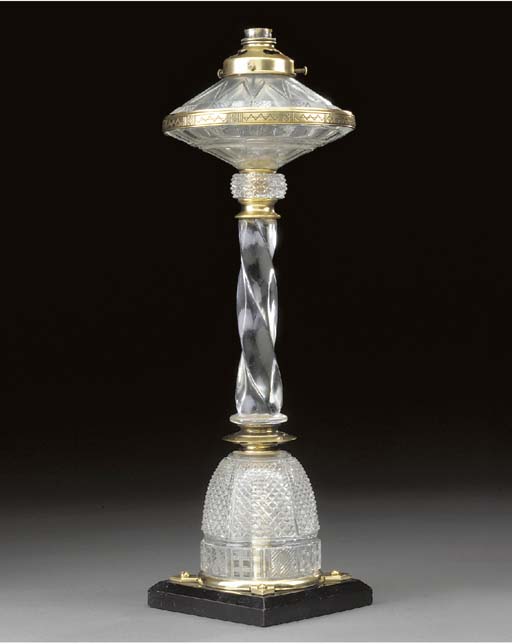 An Edwardian gilt brass and cut glass oil lamp , BY F & C OSLER, BIRMINGHAM Christie's