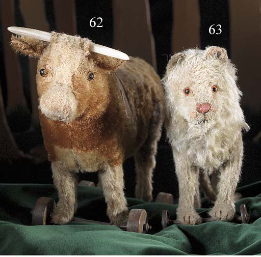 steiff cow on wheels