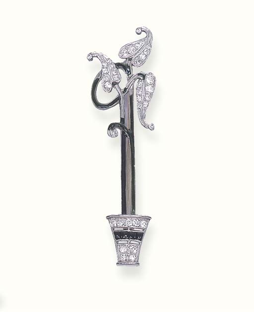 AN ART DECO DIAMOND AND ENAMEL PIN Christie's