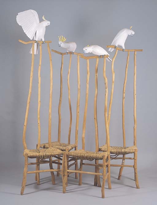 A SET OF FOUR COCKATOO CHAIRS