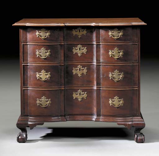 A CHIPPENDALE STYLE MAHOGANY BLOCK-FRONT CHEST-OF-DRAWERS A CHIPPENDALE STYLE MAHOGANY BLOCK-FRONT CHEST-OF-DRAWERS 