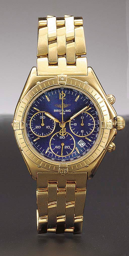 Breitling. An 18K gold waterproof chronograph wristwatch with date and