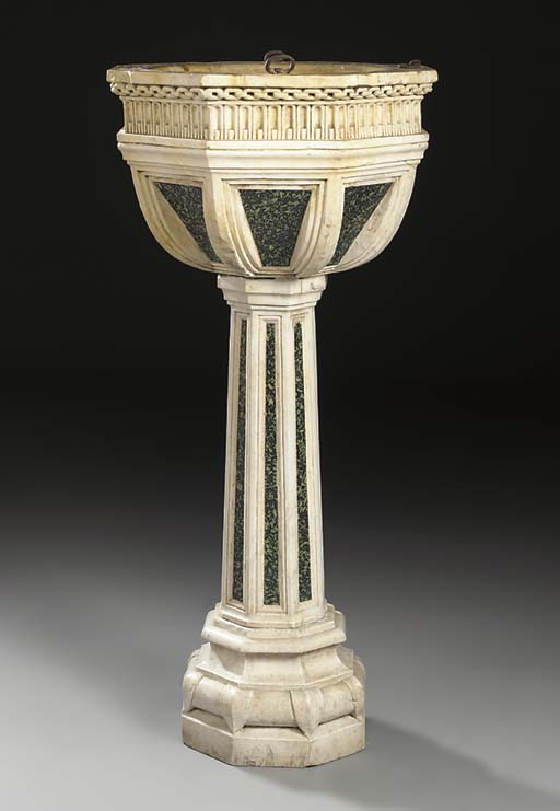 AN OCTAGONAL CARVED MARBLE BAPTISMAL FONT