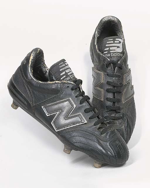 A PAIR OF BLACK LEATHER NEW BALANCE FOOTBALL BOOTS
