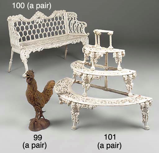 A pair of cast iron garden benches