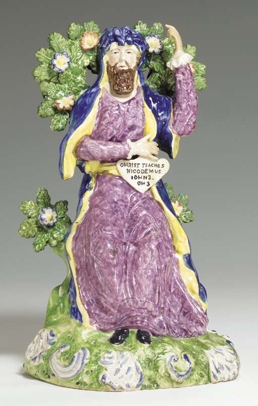 A STAFFORDSHIRE PEARLWARE FIGURE GROUP OF 'ABRAHAM OFFERING UP