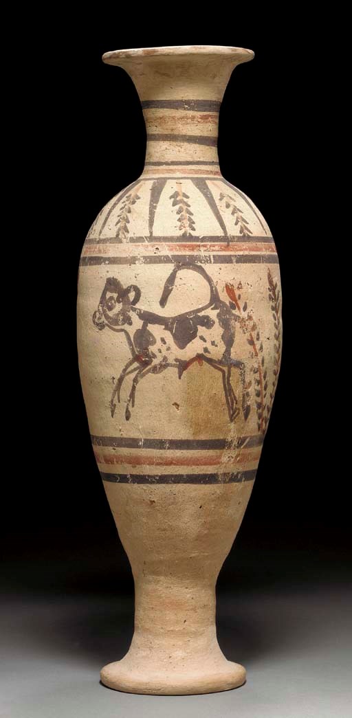 AN EGYPTIAN POTTERY VASE