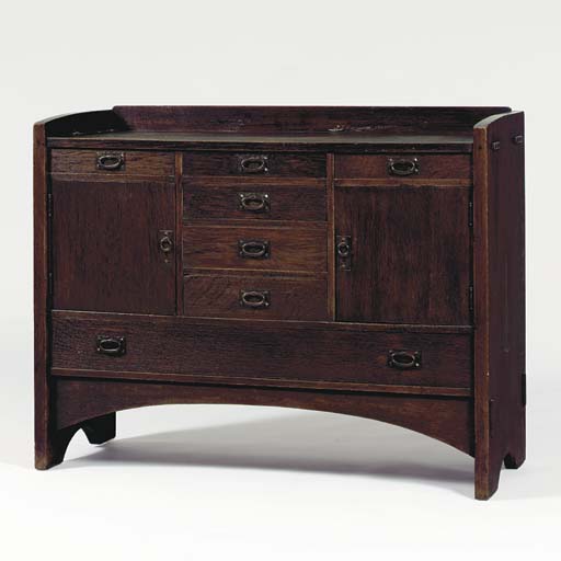 AN OAK SIDEBOARD