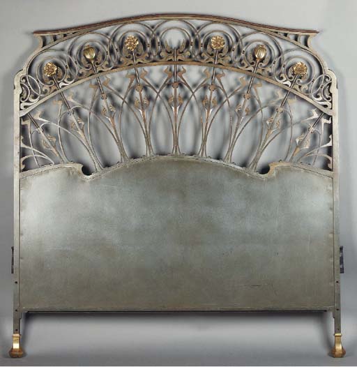 AN ART NOUVEAU PATINATED AND GILT BRONZE HEADBOARD Christie's