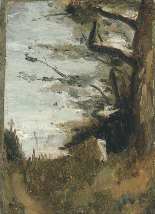 Un homme assis sous un arbre 
