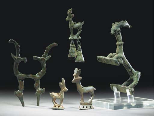 A Persian Bronze Handle In The Form Of An Ibex